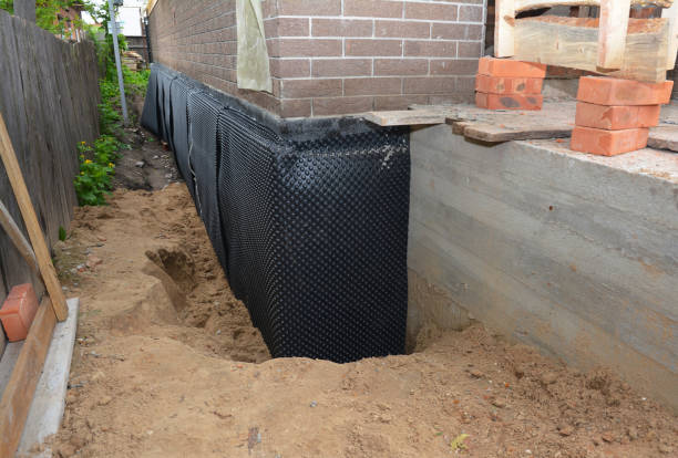 Happy homeowners after waterproofing job in Weedsport